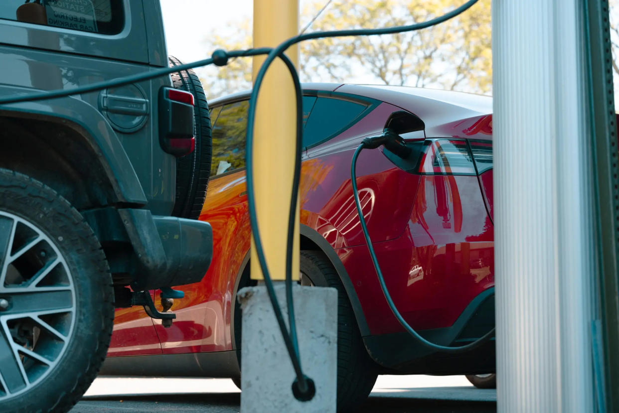 A Tesla charges at an electric vehicle charging station in New York.