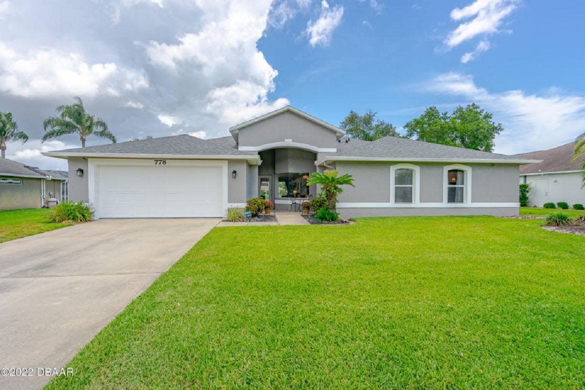This fully remodeled waterfront home in the desired Port Orange Community of Sterling Chase is zoned for Spruce Creek High School.