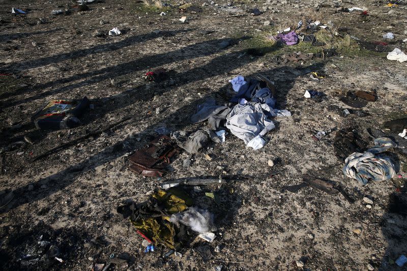 Passengers' belongings are pictured at the site where the Ukraine International Airlines plane crashed after take-off from Iran's Imam Khomeini airport, on the outskirts of Tehran