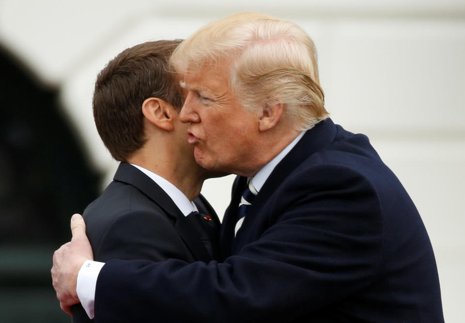 U.S. President Donald Trump kisses French President Emmanuel Macron during an arrival ceremony at the White House on&nbsp;Tuesday. (Photo: Joshua Roberts/Reuters)