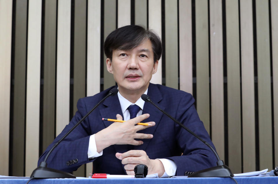 In this Sept. 2, 2019 photo, Cho Kuk, a nominee for South Korea's Justice Minister, answers a reporter's question at National Assembly in Seoul, South Korea. South Korean reporters have grilled President Moon Jae-in's nominee as justice minister for 11 hours over suspected ethical lapses surrounding his family that have triggered an intense political row and cut into Moon's popularity ratings. (Lee Jin-wook/Yonhap via AP)