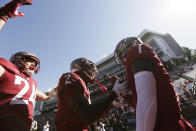 Washington State quarterback Cameron Ward (1) celebrates his touchdown with teammates wide receiver Kyle Williams (2) and tight end Cooper Mathers (24) during the first half of an NCAA college football game against Northern Colorado, Saturday, Sept. 16, 2023, in Pullman, Wash. (AP Photo/Young Kwak)
