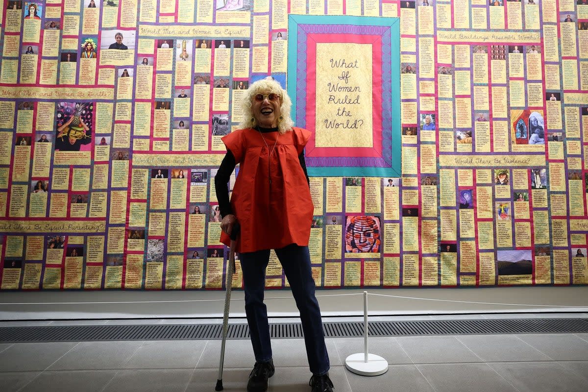 Judy Chicago in front of her artwork What if Women Ruled the World at Serpentine North (AFP via Getty Images)