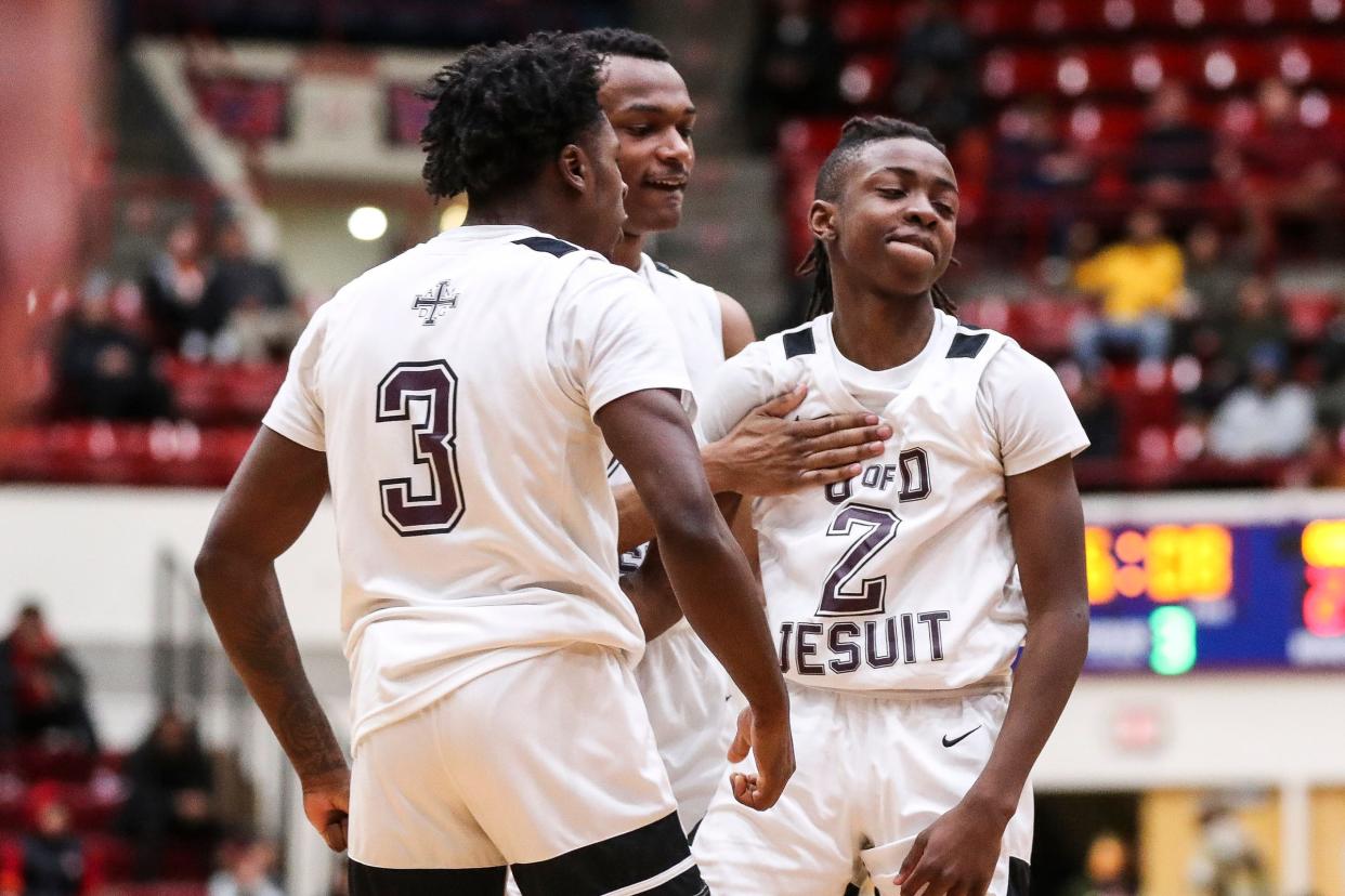 U-D Jesuit's Leroy Blyden (2) celebrates a play against Birmingham Brother Rice with teammates during the second half of the Bishop division of CHSL championship game at Calihan Hall in Detroit on Friday, Feb. 24, 2023.
