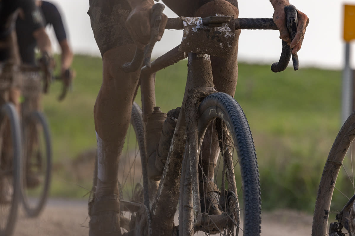  A rider almost completely obscured by mud at the 2023 Unbound 200 