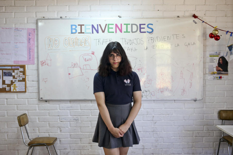 FILE - Sixteen-year-old transgender Angela poses for a photo at the Amaranta Gomez school founded by the Selenna foundation that protects transgender children and their rights, after watching a live presidential broadcast regarding the nation's new Gender Law, in Santiago, Chile, Nov. 28, 2018. Latin American countries such as Chile, Argentina, Cuba, Colombia and Mexico have issued laws that protect some rights of the LGBT community and allow transgender people to modify their official documents to match their gender identity. (AP Photo/Esteban Felix, File)