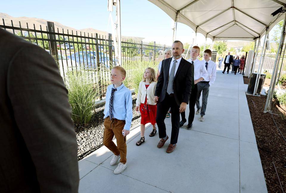 Latter-day Saints stand in line as they wait for the first of two sessions for the dedication of the Saratoga Springs Utah Temple in Saratoga Springs, Utah, on Sunday, Aug. 13, 2023. | Scott G Winterton, Deseret News