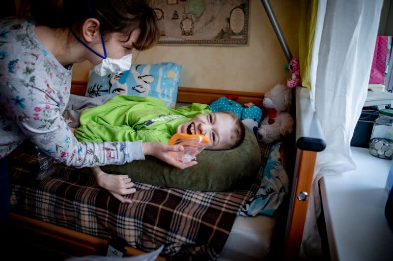 Roma from the Kuntsevsky children's home is seen in his new room in the home of play therapist and children's hospice caretaker Diana Lysenkova, where Roma will be living for the period of lockdown in Moscow