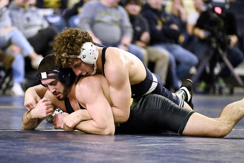 Penn State’s Mitchell Mesenbrink controls Michigan’s Cameron Amine in their 165 pound bout of the Nittany Lions’ 27-9 win on Friday night in Ann Arbor, Mich. Mesenbrink dominated the three-time All-American, 12-1.