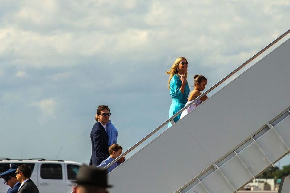 Ivanka Trump (in turqouise) and husband Jared Kushner (behind) leave Palm Beach, Florida, on March 31 | Joe Forzano/The Palm Beach Post via ZUMA