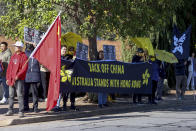 Pro China and pro Hong Kong supporters wait outside a winery where Chinese Premier Li Qiang visited in Adelaide, Australia, Sunday, June 16, 2024. (AP Photo/Kelly Barnes, Pool)