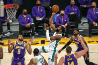 Boston Celtics' Jaylen Brown (7) shoots against the Los Angeles Lakers during the first half of an NBA basketball game Thursday, April 15, 2021, in Los Angeles. (AP Photo/Ringo H.W. Chiu)