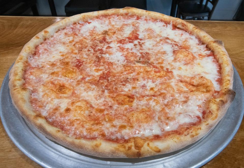 A freshly baked pizza is ready to eat Tuesday at the new Papa's Pizza location on Garden Street in downtown Pensacola.