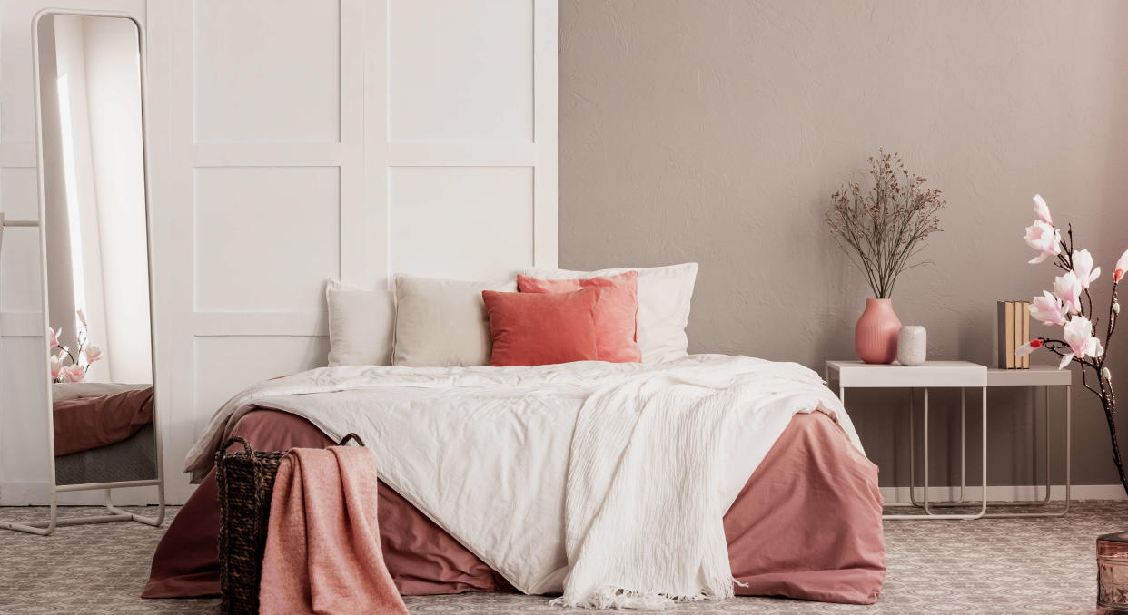  White and peach bedroom setting. 