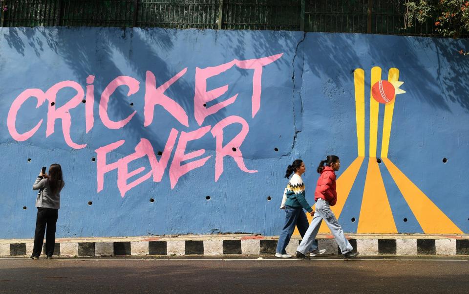 A mural on a wall outside the Himachal Pradesh Cricket Association Stadium in Dharamsala says 'Cricket fever'