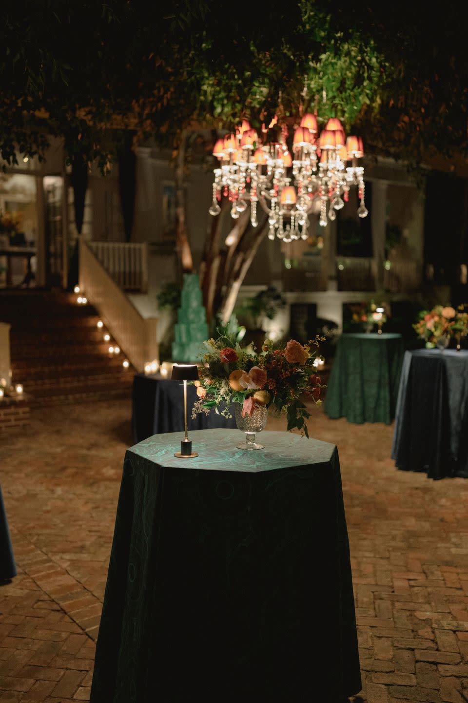 a table with flowers and candles on it