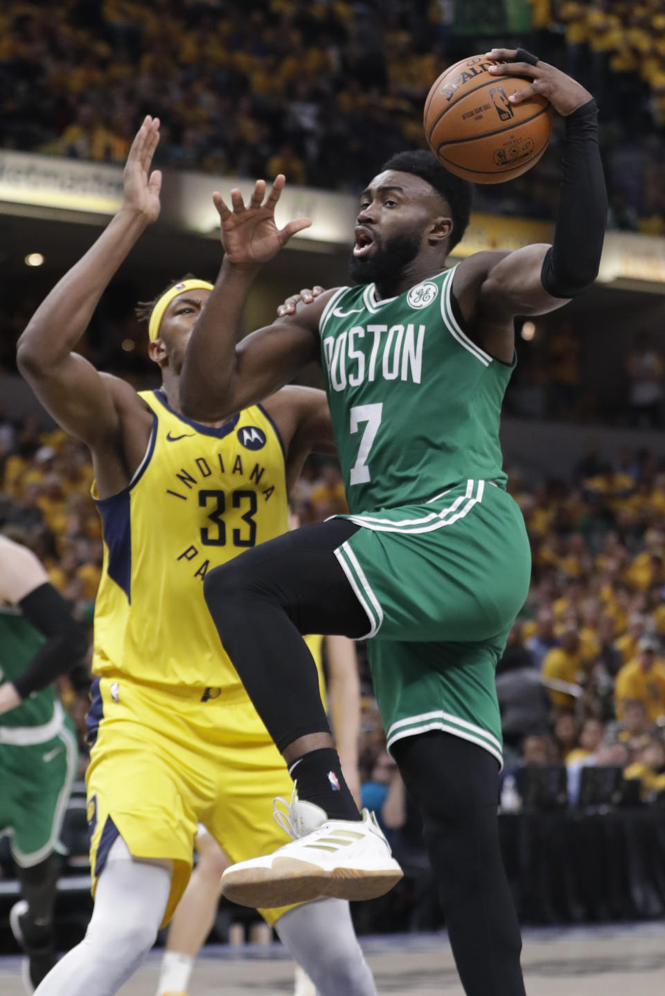 Boston Celtics guard Jaylen Brown (7) goes to the basket past Indiana Pacers center Myles Turner (33) during the second half of Game 3 of an NBA basketball first-round playoff series Friday, April 19, 2019, in Indianapolis. (AP Photo/Darron Cummings)