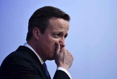 Britain's Prime Minsiter David Cameron gestures as he launches the Conservative Party's election manifesto in Swindon, western England, in this April 14, 2015 file photo. REUTERS/Toby Melville/Files