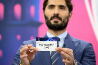 Turkish soccer player and ambassador for the UEFA Champions League final in Istanbul Hamit Altintop shows a ticket of Spain's soccer club Real Madrid CF during the UEFA Champions League 2022/23 round of 16 draw, at the UEFA Headquarters in Nyon, Switzerland, Monday, Nov. 7, 2022.(Laurent Gillieron/Keystone via AP)