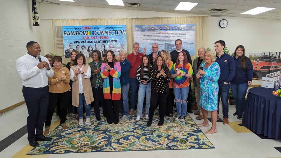 Rainbow Connection Executive Director Perci Garner (left) and volunteers participate in the organization's 51st annual telethon on Sunday.