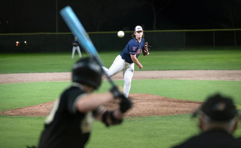 Turlock Christian’s Winston York delivers a pitch during a game with Millennium of Tracy under new LED lights at Pedretti Park in Turlock, Calif., Thursday, March 28, 2024.
