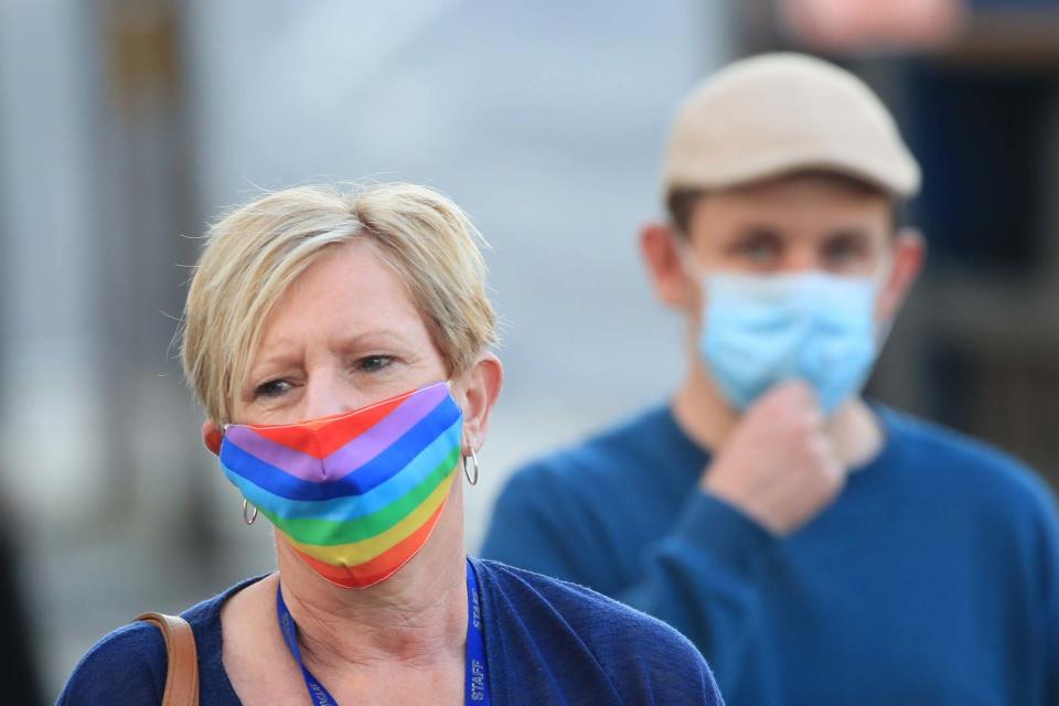 People wearing face masks in Bradford, which is also under local lockdown (PA)