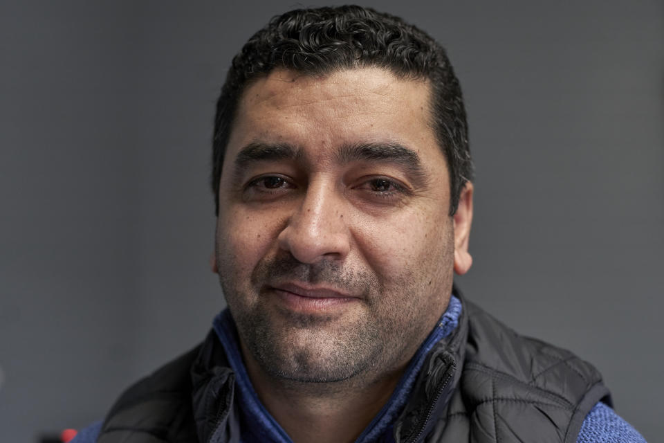 In this Dec. 19, 2019 photo, Hatim Ido poses for a photo in Lincoln, Neb., following an interview with the Associated Press. Neb. Gov. Pete Ricketts announced he would continue to allow refugees to settle in Nebraska, and in an open letter praised President Trump for adding new security layers to the vetting process. The uncertainty prior to that announcement was a major worry for Hatim Ido, a graduate student in Lincoln, Neb., who fled from Iraq to the United States after working as a translator for the U.S. Army. AP Photo/Nati Harnik)