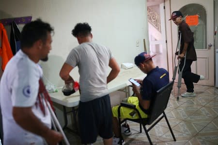 Migrants who lost legs attend a rehabilitation program