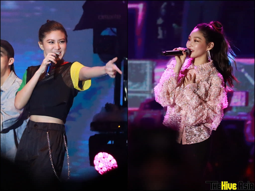 Elizabeth Tan and Chung Ha performing on the second day of UChat Songkran Day-Out.