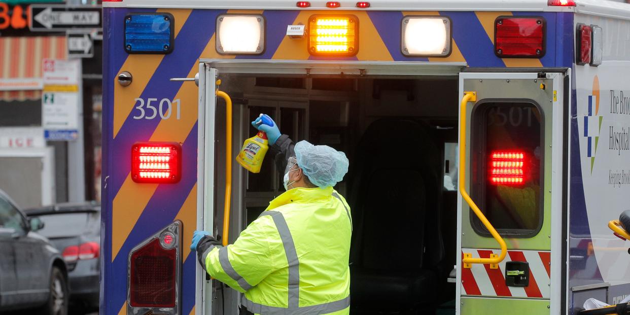 An ambulance worker sprays disinfectant inside an ambulance outside The Brooklyn Hospital Center during the coronavirus disease (COVID-19) outbreak in the Brooklyn borough of New York City, New York, U.S., March 31, 2020. REUTERS/Brendan Mcdermid