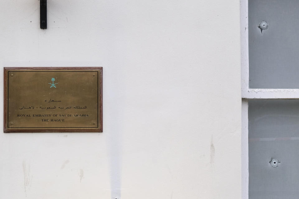 Bullet impacts are seen in the windows of Saudi Arabia's embassy in The Hague, Netherlands, Thursday, Nov. 12, 2020, after several shot were fired at the building early in the morning. Nobody was injured and police were investigating. (AP Photo/Mike Corder)