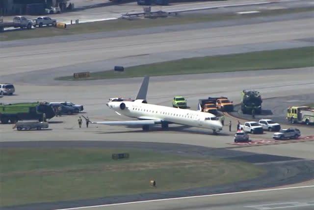 <p>WSB/AP</p> Damaged Delta plane after collision at Atlanta airport