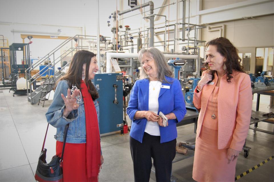 U.S. Rep. Teresa Leger Fernandez, left, San Juan College School of Energy Dean Alicia Corbell and San Juan College President Toni Hopper Pendergrass converse during a tour by Fernandez on May 5 of the college campus in Farmington.