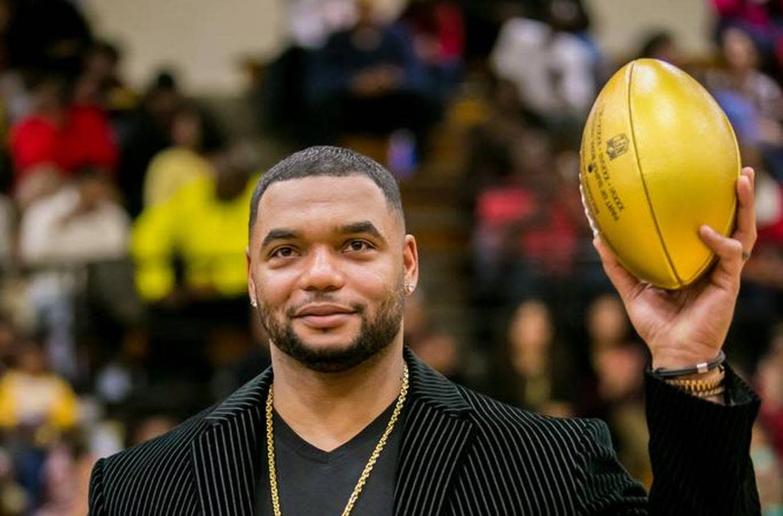 Former Lower Richland football Richard Seymour, who won three Super Bowls with the New England Patriots, is presented with a golden football as part of an NFL program honoring the high schools of Super Bowl participants.