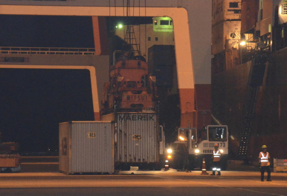 In this Thursday, May 30, 2019, photo released by the Department of Foreign Affairs, workers load containers with garbage from Canada on the cargo ship M/V Bavaria at Subic port in Zambales province, northwestern Philippines. The Philippines, one of two Southeast Asian countries that protested being treated like dumpsites by wealthier nations, on Friday, May 31, 2019, shipped 69 containers of what it's officials called illegally transported garbage back to Canada. (Nilo Palaya, DFA - Office of Strategic Communications and Research via AP)