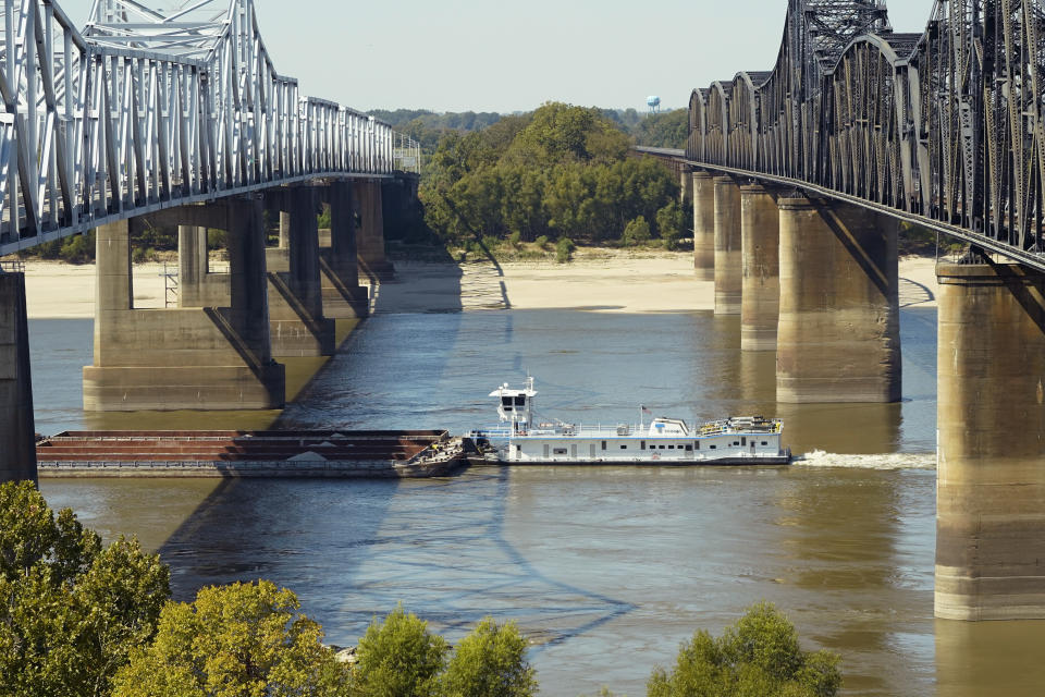 FILE - A boat navigates the Mississippi River in Vicksburg, Oct. 11, 2022. The unusually low water level in the lower Mississippi River has caused some barges to get stuck in the muddy river bottom, resulting in delays. (AP Photo/Rogelio V. Solis, File)