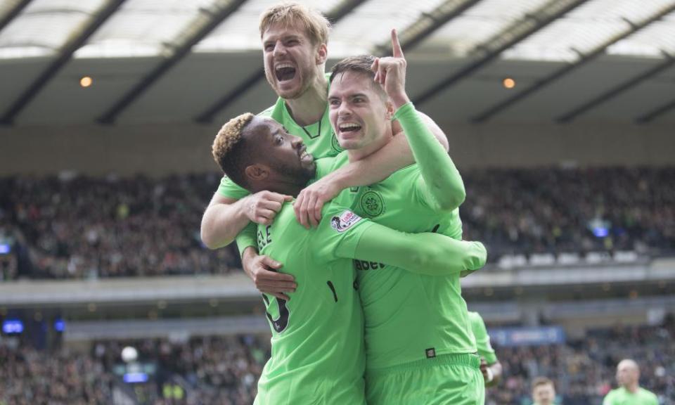 Moussa Dembélé celebrates his goal, Celtic’s third, with Michael Lustig and Stuart Armstrong.