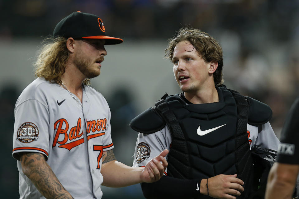 Star Orioles catcher Adley Rutschman (right) consults with pitcher Nick Vespi as they walk to the dugout after an inning. (Photo by Tim Heitman/Getty Images)