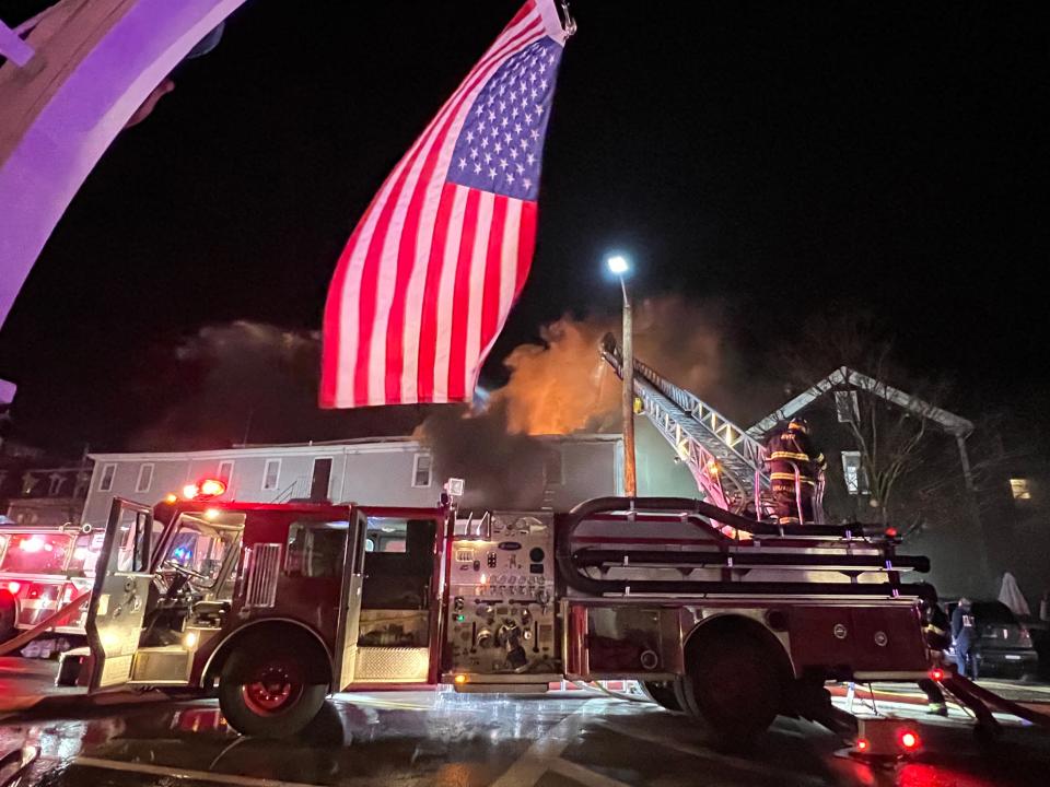 Flames break through the roof of the Harborside Inn on Block Island as fire crews battle the blaze.