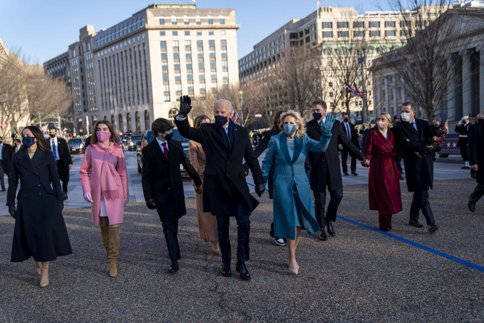 President Joe Biden, First Lady Jill Biden and family, walk near the White House during a Presidential Escort to the White House, Wednesday, Jan. 20, 2021 in Washington. (Doug Mills/The New York Times via AP, Pool)