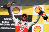 SPA, BELGIUM - SEPTEMBER 02: Jenson Button of Great Britain and McLaren celebrates on the podium after winning the Belgian Grand Prix at the Circuit of Spa Francorchamps on September 2, 2012 in Spa Francorchamps, Belgium. (Photo by Mark Thompson/Getty Images)