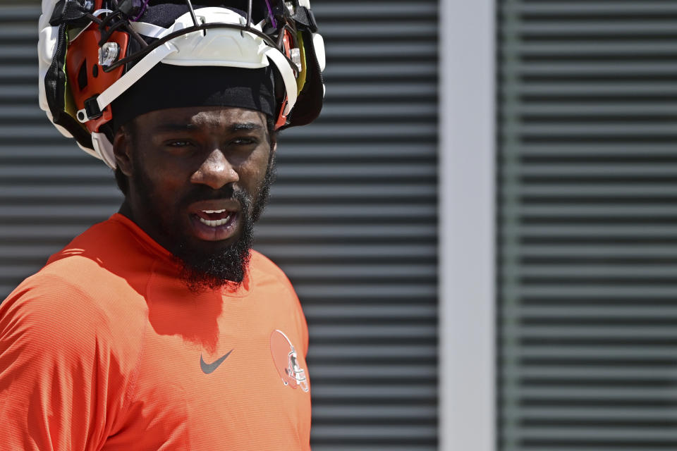 Cleveland Browns linebacker Jeremiah Owusu-Koramoah walks before an NFL football practice in Berea, Ohio, Friday, July 29, 2022. (AP Photo/David Dermer)