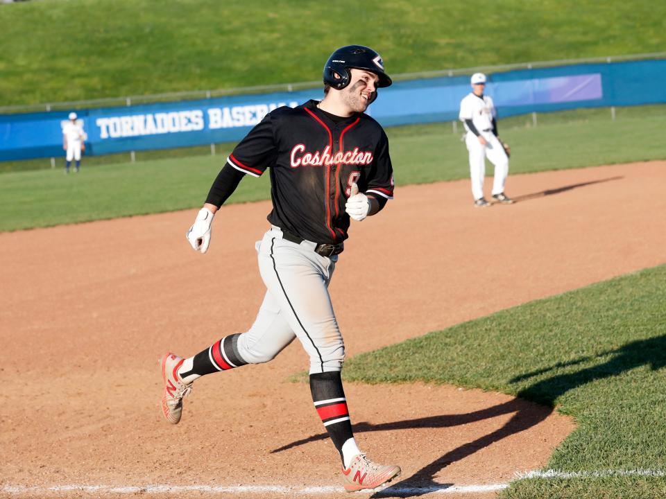 Coby Moore rounds the bases after hitting a home run during Coshocton's 11-10 win against host West Muskingum on April 18, 2023, in Falls Township.