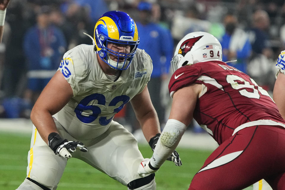 FILE - Los Angeles Rams guard Austin Corbett (63) gets set during an NFL football game against the Arizona Cardinals, Dec. 13, 2021, in Glendale, Ariz. The Carolina Panthers agreed to terms on a three-year $29.5 million contract with Corbett, according to a person familiar with the situation. The person spoke to The Associated Press condition of anonymity Monday, March 14, 2022, because the deal will not become official until the start of free agency on Wednesday. (AP Photo/Rick Scuteri, File)