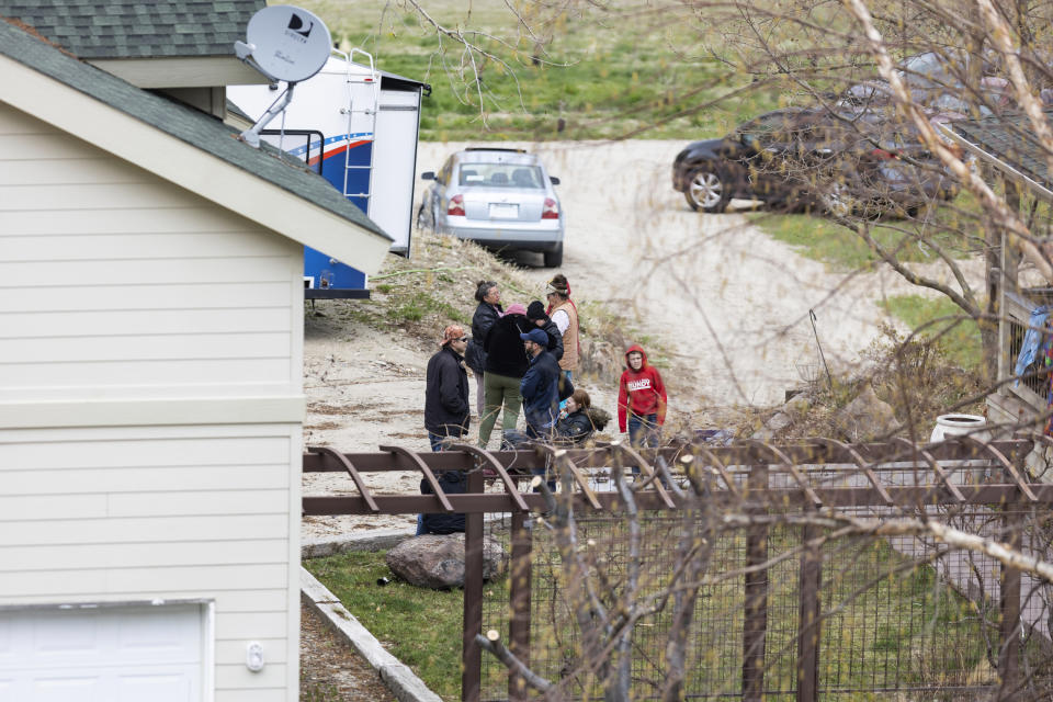 FILE - Supporters gather on the property of former Idaho gubernatorial candidate and far-right activist Ammon Bundy after law enforcement officers attempted to arrest Bundy on a misdemeanor warrant for contempt of court earlier in the day, on Monday, April 24, 2023, in Emmett, Idaho. Bundy was not home at the time, and the officers left. The contempt warrant came in a defamation lawsuit brought against Bundy and others by a regional hospital system. (AP Photo/Kyle Green, File)