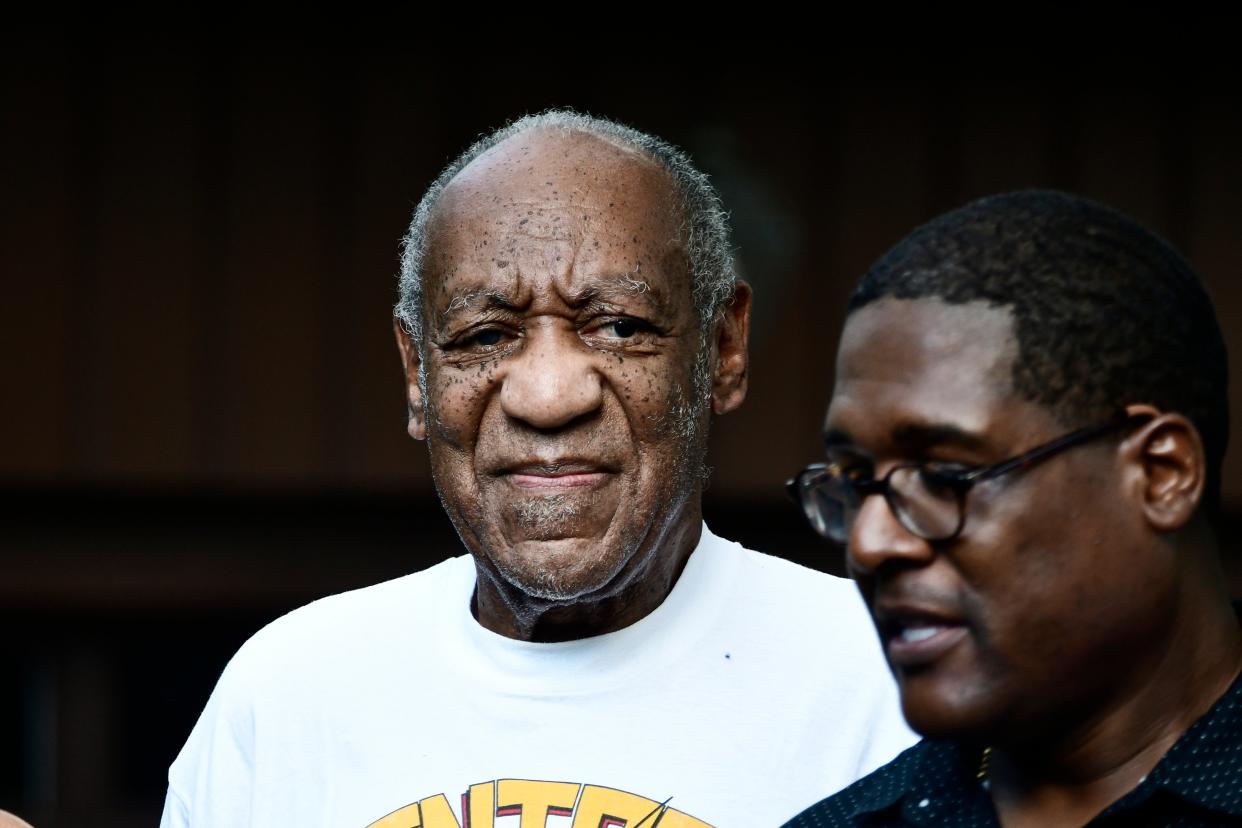 Bill Cosby, freed from jail, and his spokesman  (EPA)