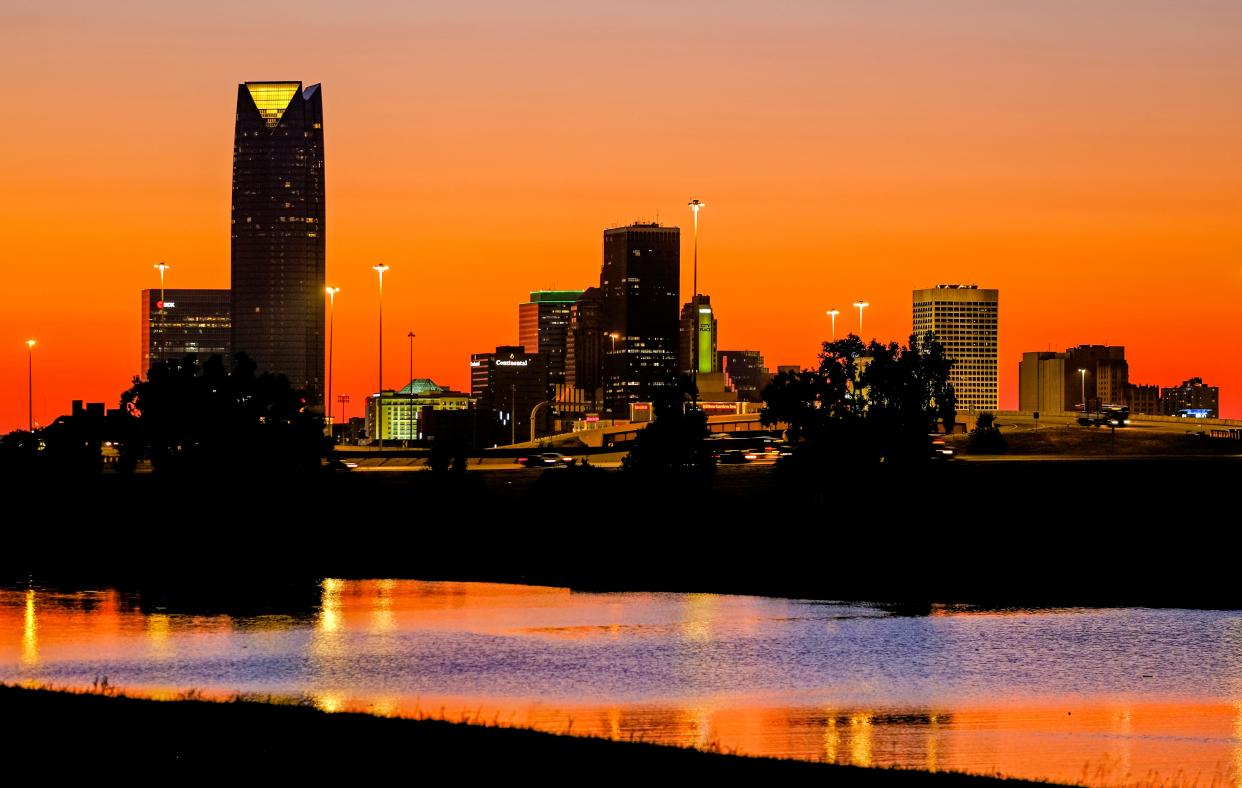 Oklahoma City downtown skyline at sunset is reflected Sunday, Sept. 19, 2021, in the Oklahoma River.