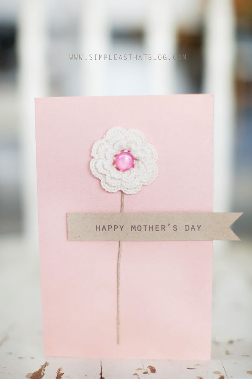 <p>A button and a doily create a simple and sweet flower that'll impress mom on Mother's Day and beyond. </p><p><em><a href="https://simpleasthatblog.com/simple-mothers-day-card-ideas/" rel="nofollow noopener" target="_blank" data-ylk="slk:Get the tutorial at Simple as That »;elm:context_link;itc:0;sec:content-canvas" class="link ">Get the tutorial at Simple as That »</a></em></p>