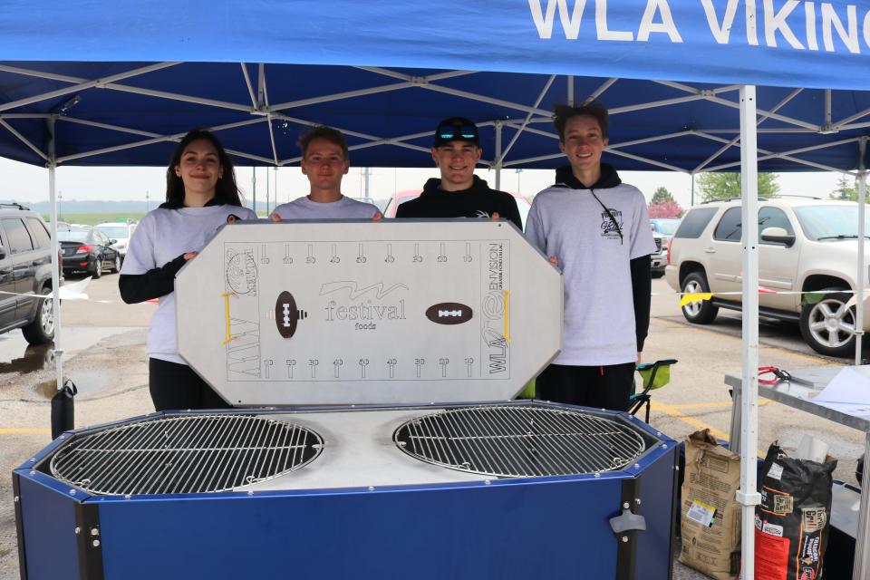 Project G.R.I.L.L 2023 participants represented area high schools as they unveil grills they made while learning about local manufacturing businesses and how to take a project from idea to completion.