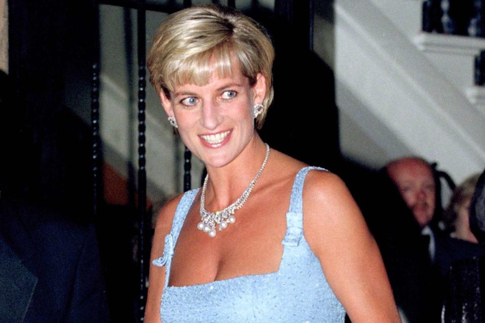 <p>Julian Parker/UK Press via Getty </p> Princess Diana attends Swan Lake at London